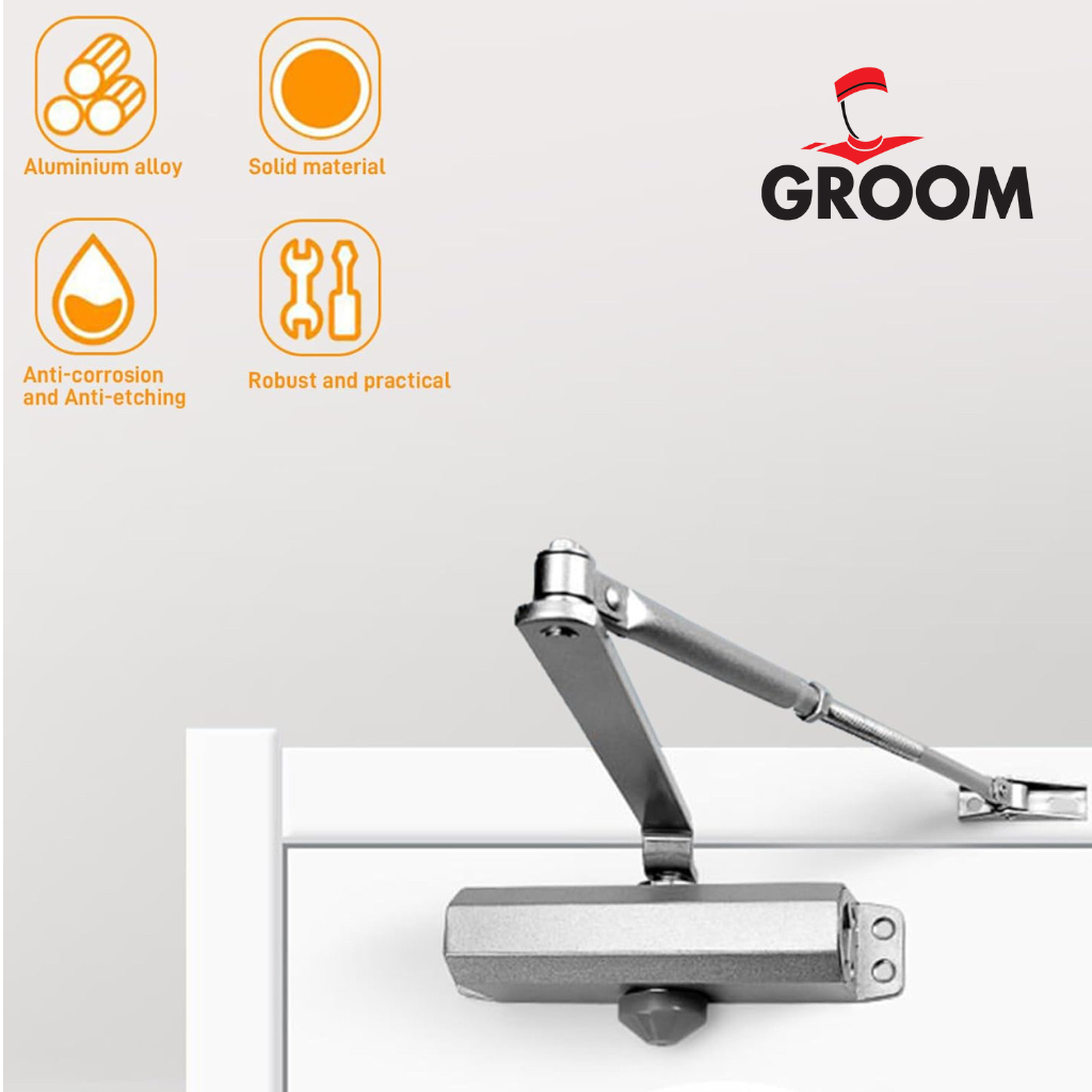 Ferme-porte groom argent avec bras compas hydraulique, capacité 60kg, finition professionnelle"
"Vue détaillée du mécanisme hydraulique du ferme-porte groom argent SQES"
"Installation du , bras compas visible